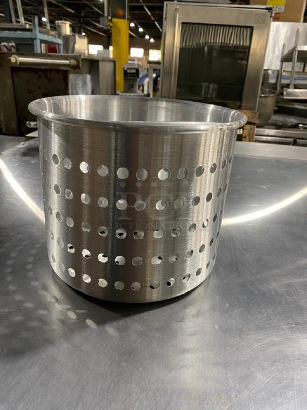 Stainless steel perforated basket for industrial use, excellent condition. Features circular holes and a sturdy build.