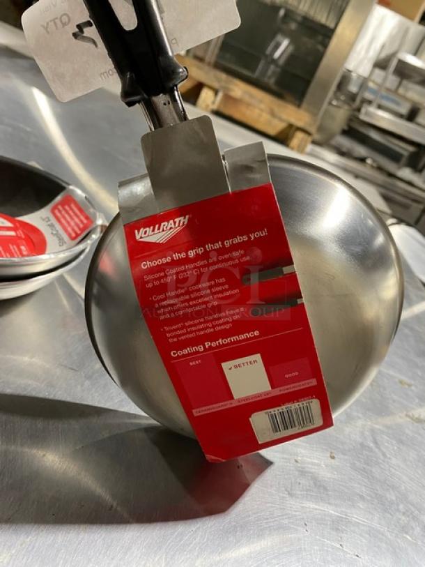 Vollrath frying pan with silicone-coated handle, stainless steel, new with tag detailing grip and coating performance.