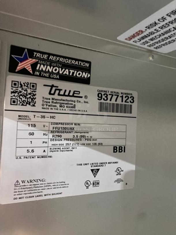 Label on a True Refrigeration unit, model T-35-HC. Features include compressor MM: FFU130JAX, R290 refrigerant. Serial number: 9377123. Made in the USA.