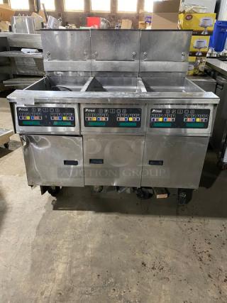 Pitco triple bay deep fryer with digital controls, stainless steel body, visible wear and dents, ideal for commercial kitchens.