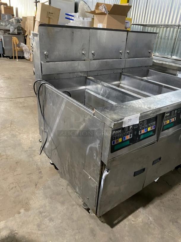 Commercial Pitco deep fryer with multiple vats, stainless steel, digital controls, used condition, warehouse setting.