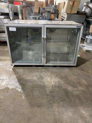 Commercial double-door fridge, stainless steel, glass front, used condition, model CR225, labeled "21."