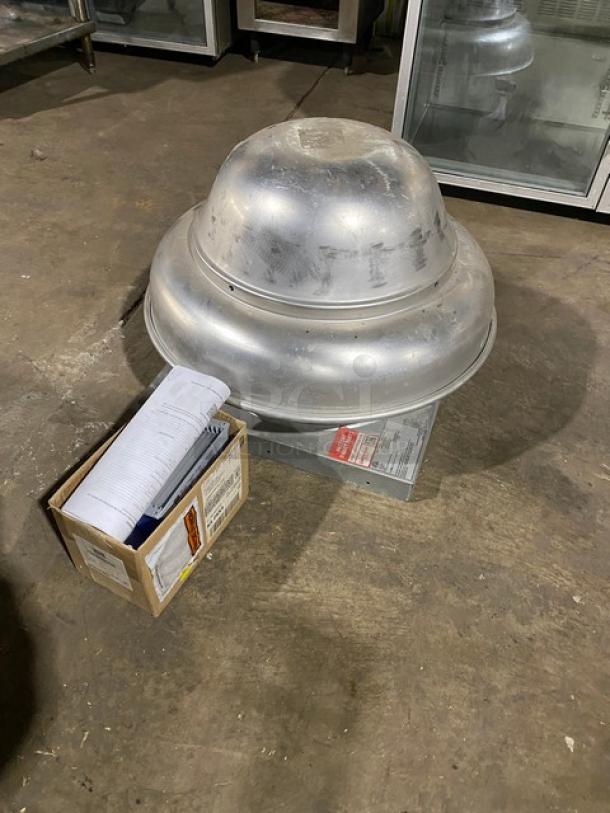 Commercial rooftop exhaust fan in metal, used condition, with connected wiring box. Includes installation manuals and labels.