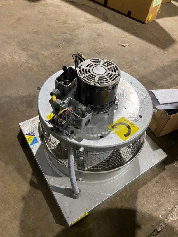 Industrial electric motorized fan unit, used condition, with visible wiring and caution label. Ideal for ventilation applications.