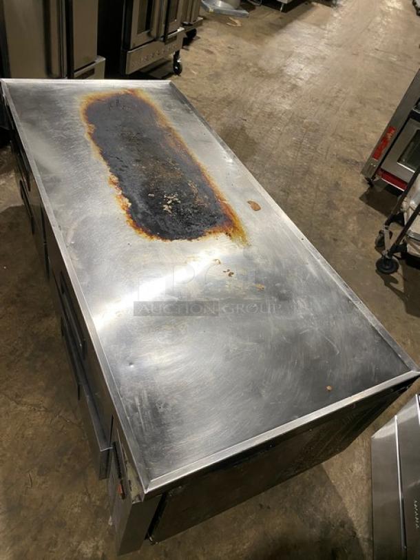 Stainless steel commercial refrigerator with rust and wear on top, three compartments, good for restoration or parts.