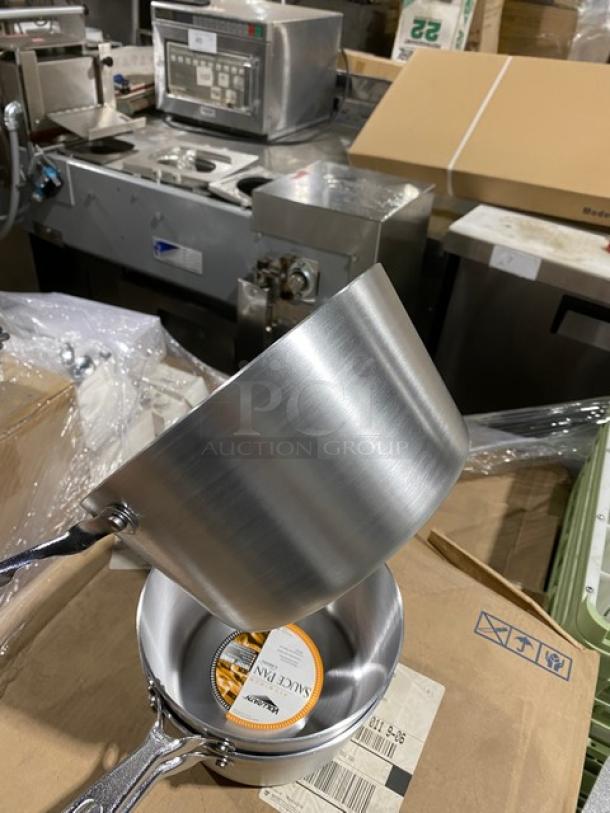 Stainless steel saucepan with label, new condition, long handle, smooth finish, ideal for professional or home kitchen use.