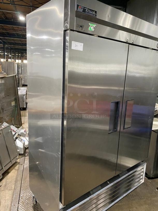 Stainless steel True commercial double-door refrigerator, model T-49, in excellent condition, label marked "31".