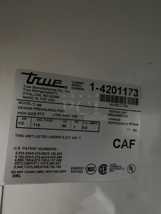 Label from True Refrigeration Model T-49 with specs: 1/2 HP, 115V, refrigerant R134A, NSF certified, made in USA.
