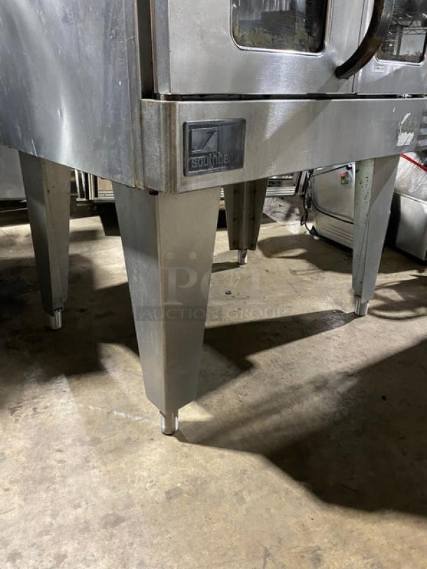 Southbend industrial oven, stainless steel, used condition, visible wear, sturdy legs, branded emblem on front.