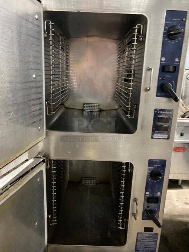 Cleveland double-deck convection steamer, stainless steel, control knobs, safety labels, used condition, commercial kitchen equipment.