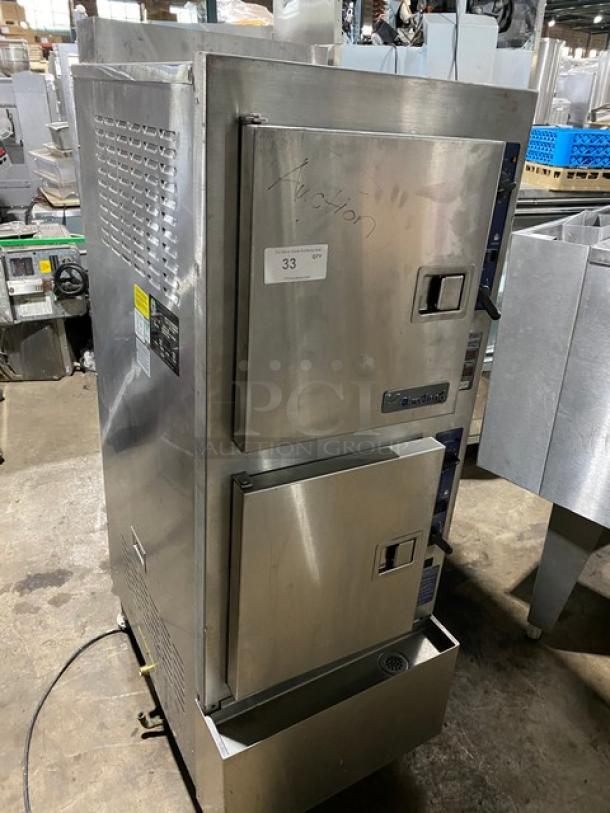 Commercial stainless steel double-door steamer oven, Vulcan brand, model visible, marked as auction item 33. Good condition.