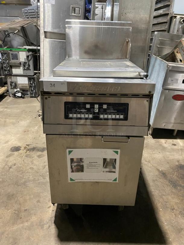 Commercial Frymaster deep fryer, model 34, with digital controls and stainless steel body, in used condition.