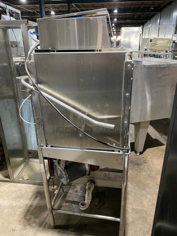 Commercial stainless steel dishwasher, industrial-grade, used condition with visible plumbing connections.
