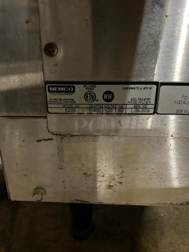 NEMCO food equipment label showing model 6205, 1800 watts, 120 volts, NSF certified, made in the USA, serial L09-009.