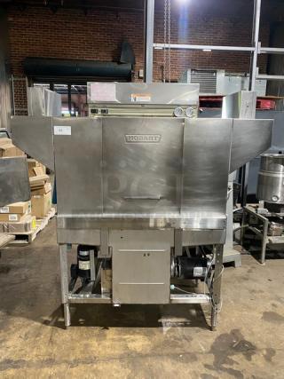 Hobart commercial dishwasher, stainless steel, industrial model with visible dials and controls, in used condition.