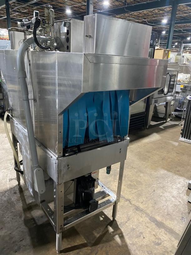 Industrial stainless steel dishwasher with blue entrance flaps, used condition, suitable for high-volume kitchens.