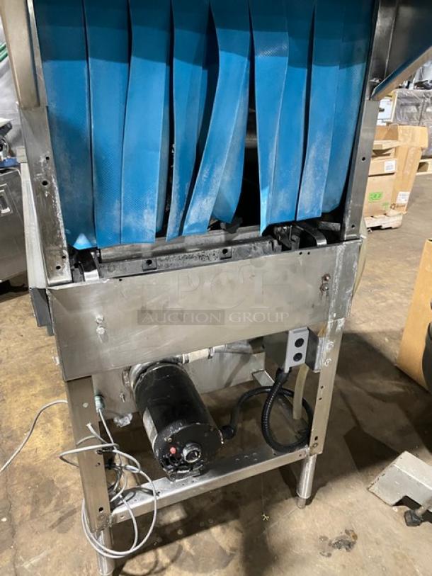 Industrial food processing machine with blue conveyor belts. Stainless steel frame, motor visible. Used condition.