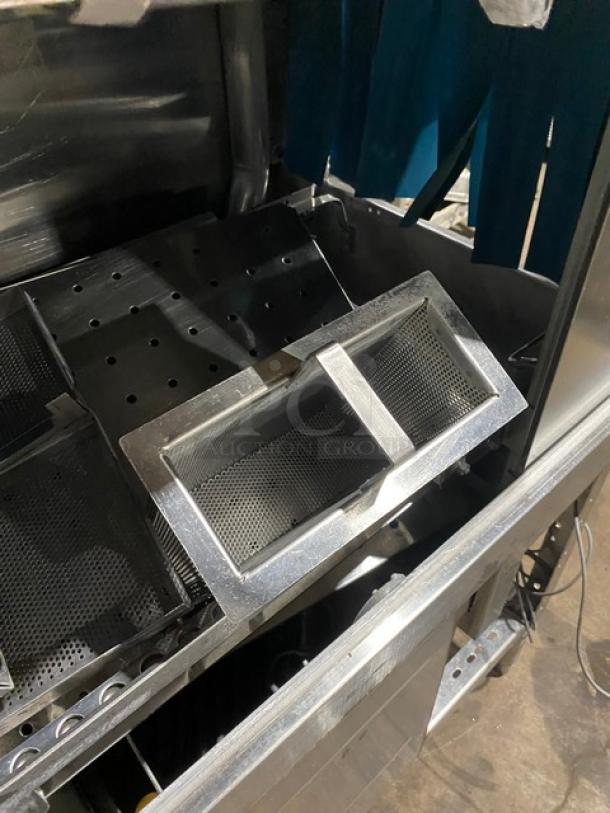 Industrial metal sieve trays in stainless steel, shown in good condition, with perforated surfaces and robust frames.