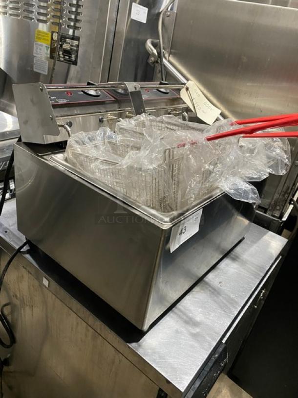 Commercial deep fryer with dual baskets, red handles, and stainless steel body. Appears in excellent condition. Label: "43".
