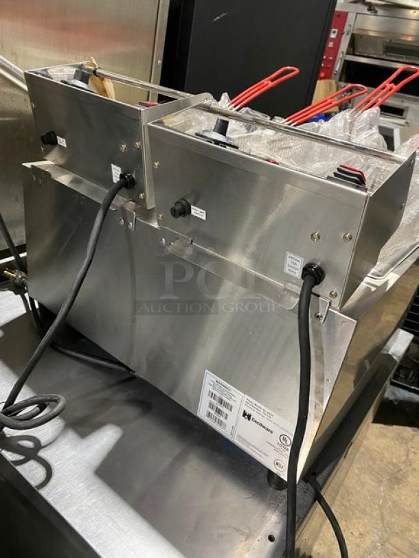 Commercial double deep fryer in stainless steel, dual power cords, labels indicating UL certification, excellent condition.