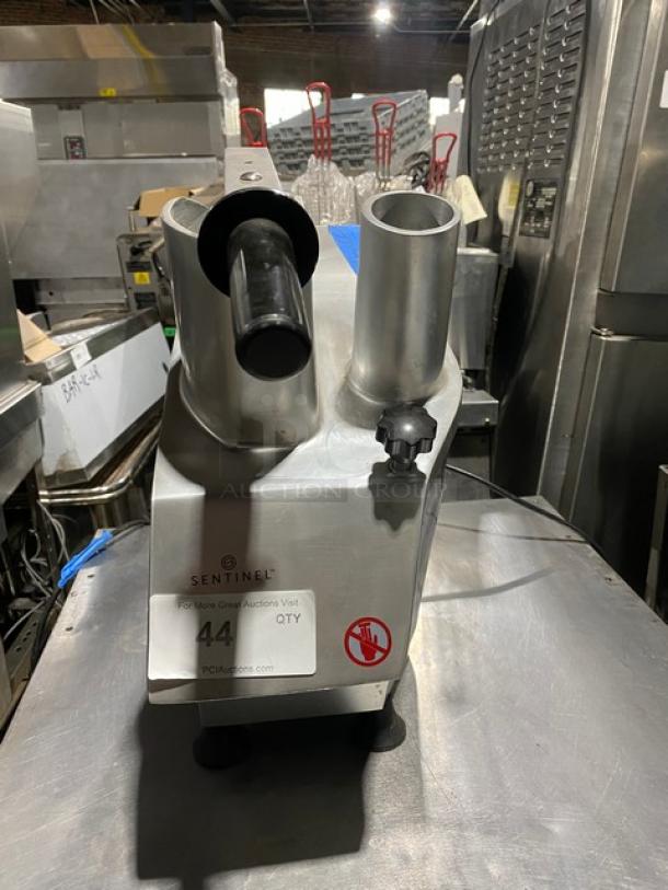 Sentinel commercial food processor, heavy-duty metal body, prominent feeding tubes, model label visible, used condition.