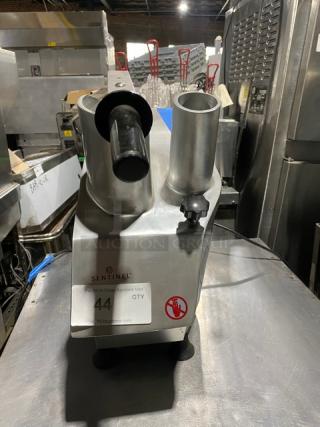 Sentinel commercial food processor, heavy-duty metal body, prominent feeding tubes, model label visible, used condition.