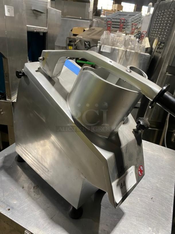 Commercial stainless steel vegetable slicer, sturdy design, excellent condition, with identifiable control knobs and visible safety features.