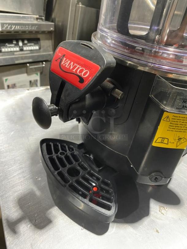 Avantco commercial food processor, black and silver, with safety lock handle, warning labels, and vented base.