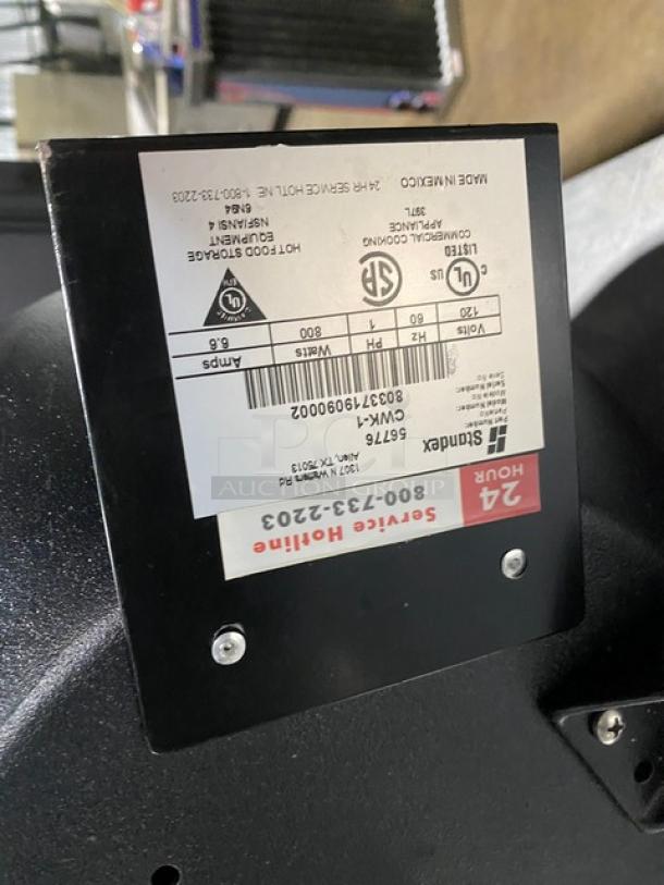 Sukara hot food storage unit label showing model 5676, 800 watts, 6.6 amps, service hotline info, and certification marks.