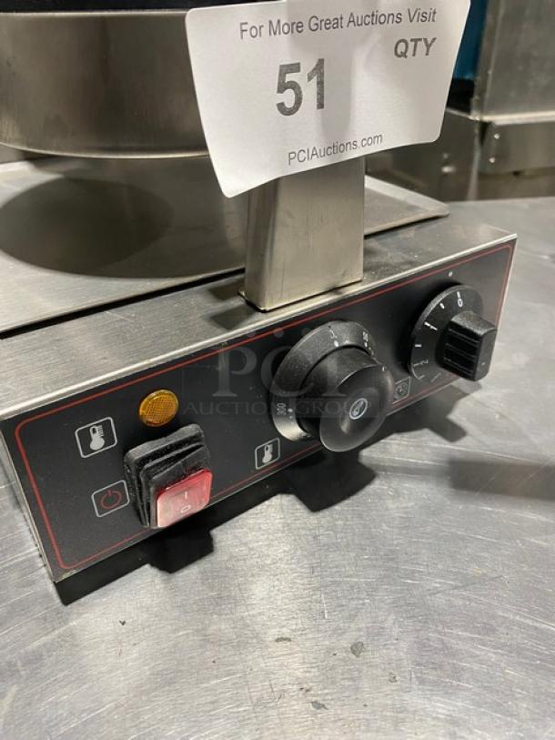Commercial kitchen appliance control panel with two dials and a switch. Tag marked "51" from PCIAuctions.com.