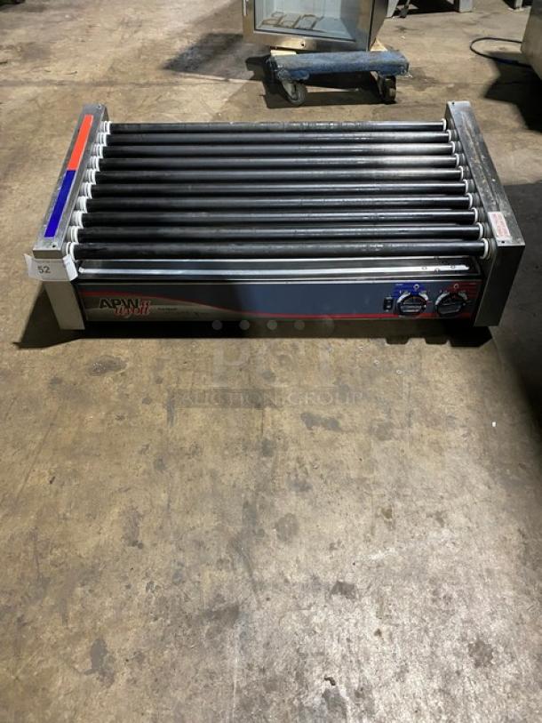 Commercial hot dog roller by APW Wyott, model HRS-50S, features 11 rollers, temperature controls, and steel construction; unit 52.