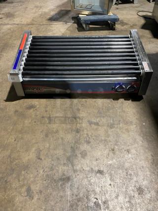 Commercial hot dog roller by APW Wyott, model HRS-50S, features 11 rollers, temperature controls, and steel construction; unit 52.