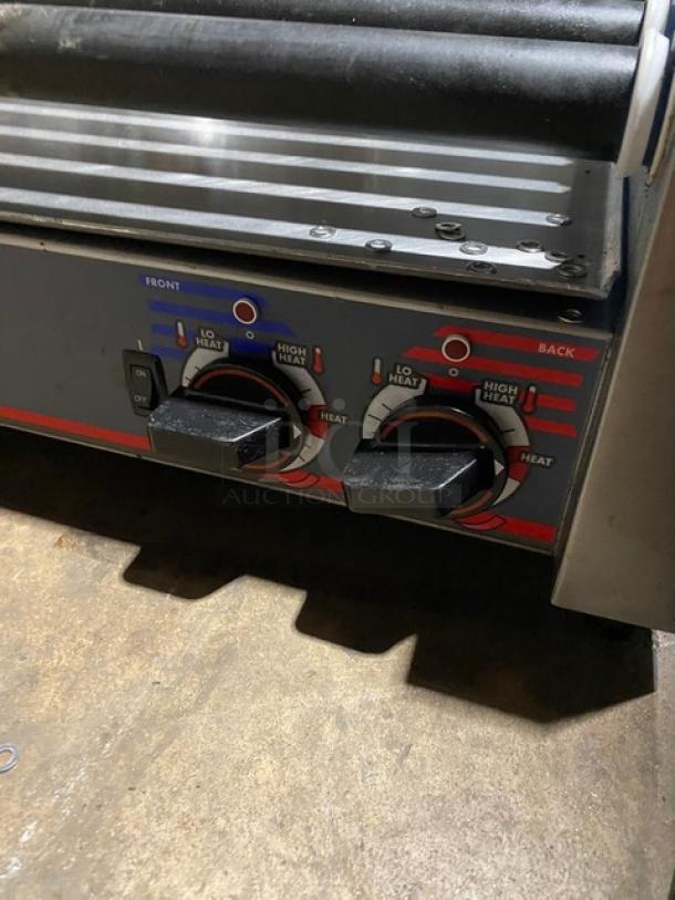 Commercial hot dog roller grill with dual heat settings, front and back controls, displays "Lo Heat" to "High Heat."