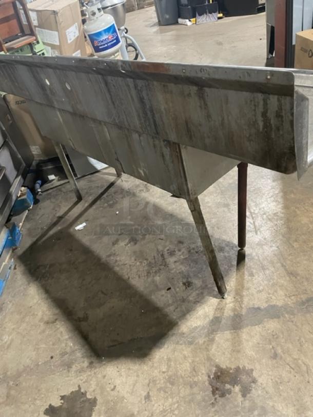 Commercial stainless steel 3-compartment dishwashing prep sink with left/right drain boards, backsplash, and sturdy legs.