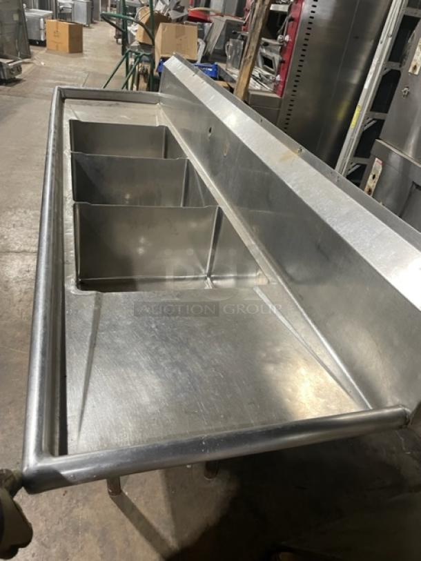 Commercial stainless steel 3-compartment sink with left and right drain boards, backsplash, and sturdy legs.