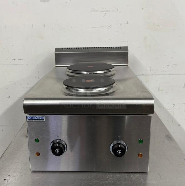 Prepline stainless steel electric cooktop with two burners, model PPHC12-S, in excellent condition. Dual control knobs.