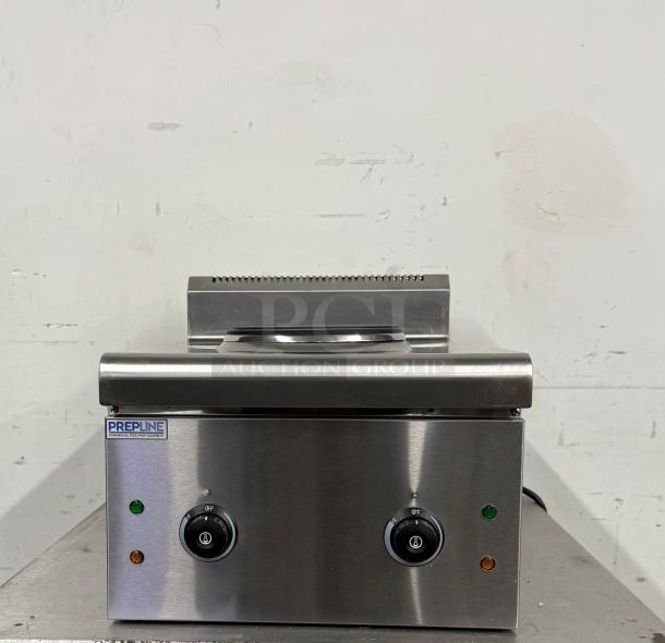 Prepline commercial food prep equipment in stainless steel. Features dual knobs, indicator lights, and clean finish. Brand labeled.