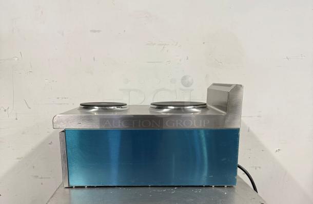 Stainless steel dual-burner hot plate with blue side panel, electric cord attached, excellent condition, minor surface marks.