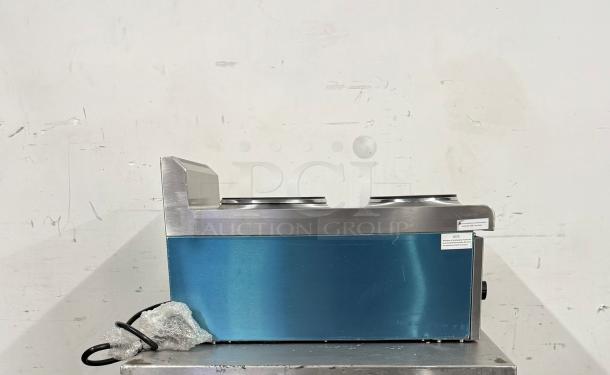 Commercial countertop soup warmer, stainless steel and blue exterior, dual wells, power cord included, used condition.
