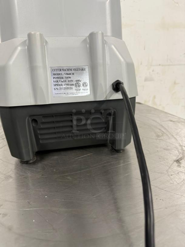 Vegetable cutter machine, model VB60CH. Power: 735W, 115V, 1750 rpm. Serial No: 202203026. Used, good condition.
