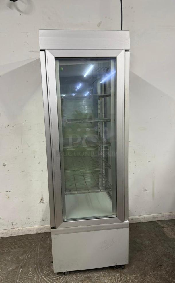 Commercial glass display refrigerator, stainless steel frame, multiple shelves, good condition, suitable for retail use.