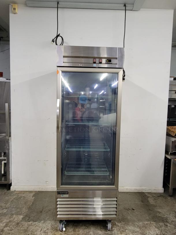 Commercial Dukers glass door refrigerator on wheels, stainless steel, three shelves, digital controls, excellent condition.