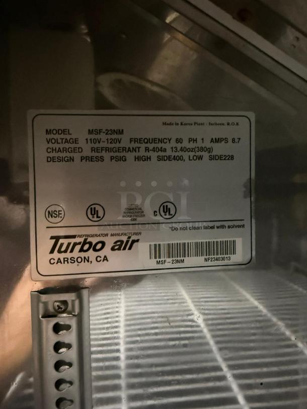 Turbo Air refrigerator model MSF-23NM label; 110V-120V, 60Hz, refrigerant R-404a, NSF certified, made in Korea.