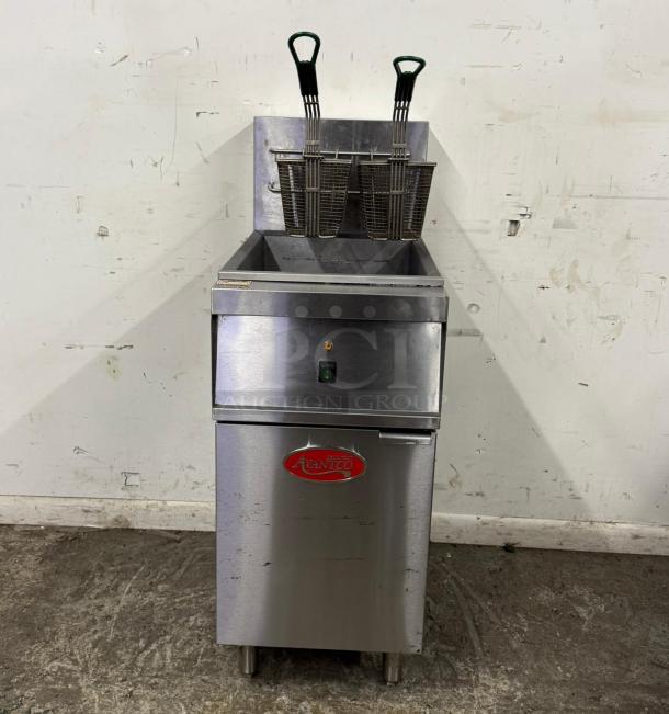 Commercial deep fryer by Avantco, stainless steel, used condition, two baskets, front label with brand logo, power switch visible.