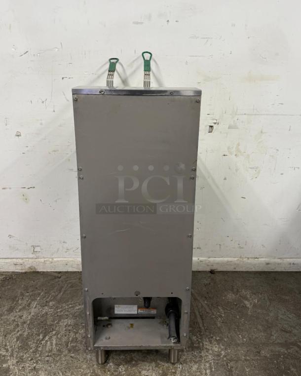 Stainless steel commercial kitchen equipment, durable construction, dual green-handled controls, visible cords and labels.