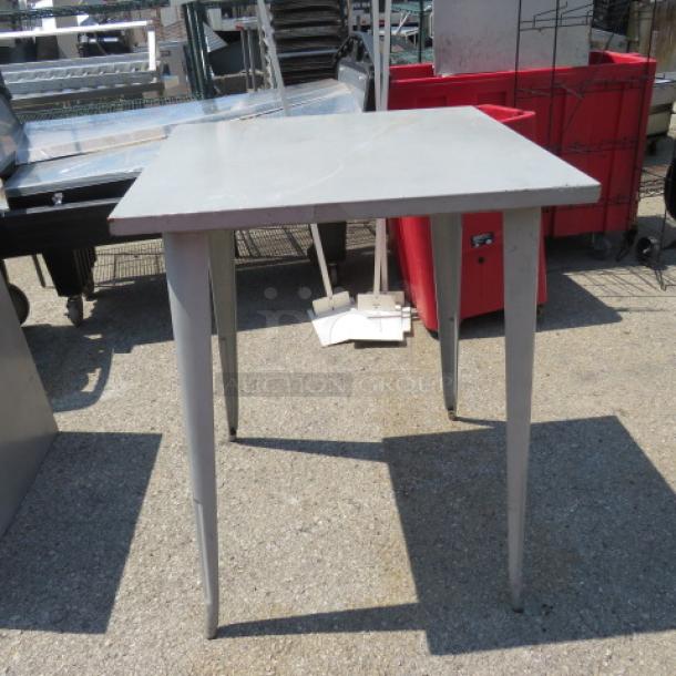 Aluminum bar height patio table, 31.5x31.5x41.5 inches, square top, sturdy metal legs, outdoor use, good condition.