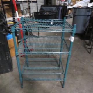 Green coated Metro shelf, 3-tier, 24x18x36 inches, excellent condition. Ideal for storage, durable wire construction.
