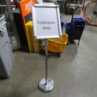 Adjustable changeable sign with "Employees Only" text, silver stand, used condition. Ideal for indoor direction or information.