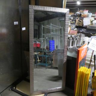 Framed floor-length mirror, 29x65 inches, textured metallic frame, excellent condition, warehouse background.