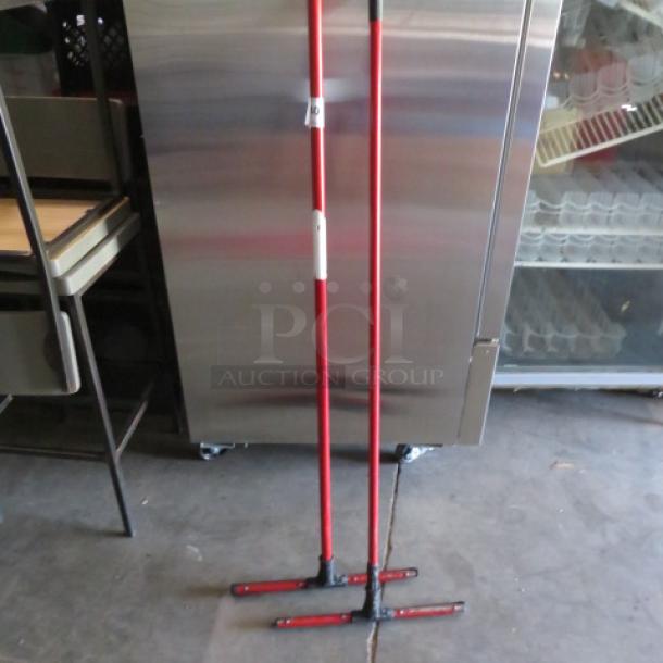 Red Squeegee with long handle, model 2XBID, in excellent condition, suitable for industrial use.